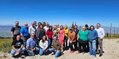 Central Utah Leaders group on the mountain top looking over the valley below