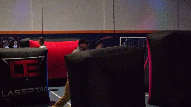 Laser Tag with blow up obstacles in the blue gym at Snow College